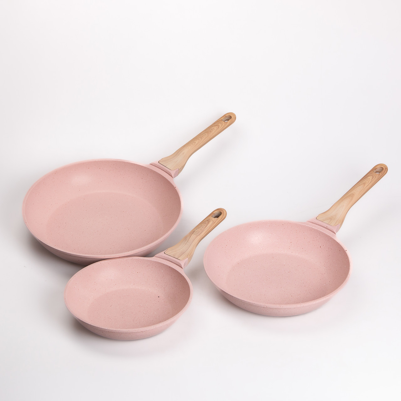 Рожевий набір сковорідок з антипригарним керамічним покриттям для різних плит