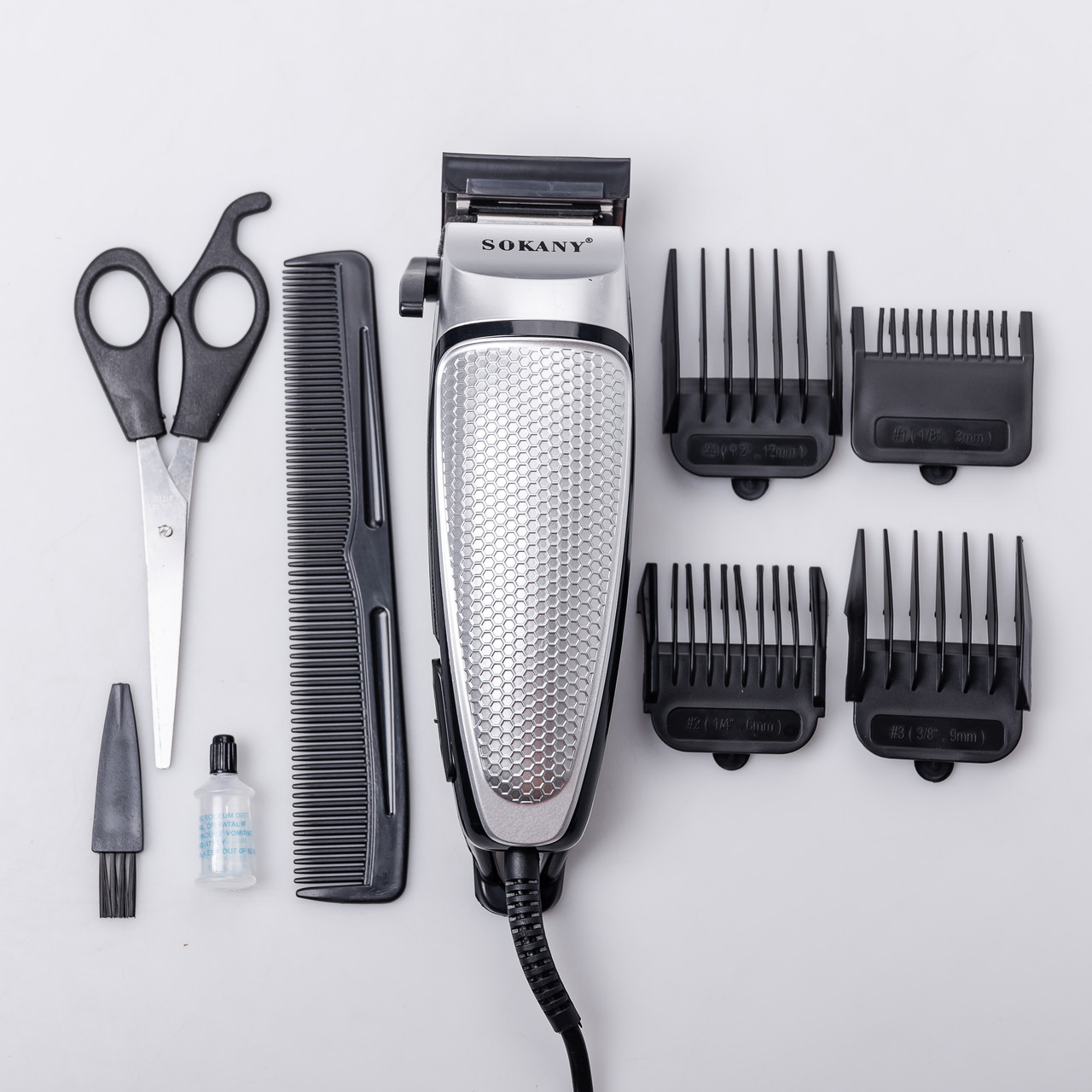 Машинка для стрижки волосся електрична 10 Вт універсальна 4 насадки Срібляста Sokany