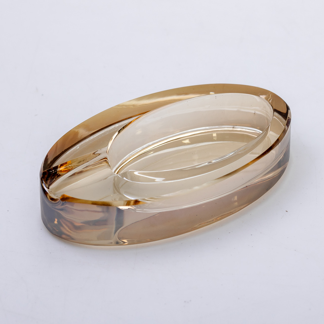 Золотиста скляна попільничка овальної форми для столу